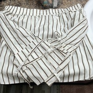 Look sexy and preppy at the same time in the stripped off the shoulder top.